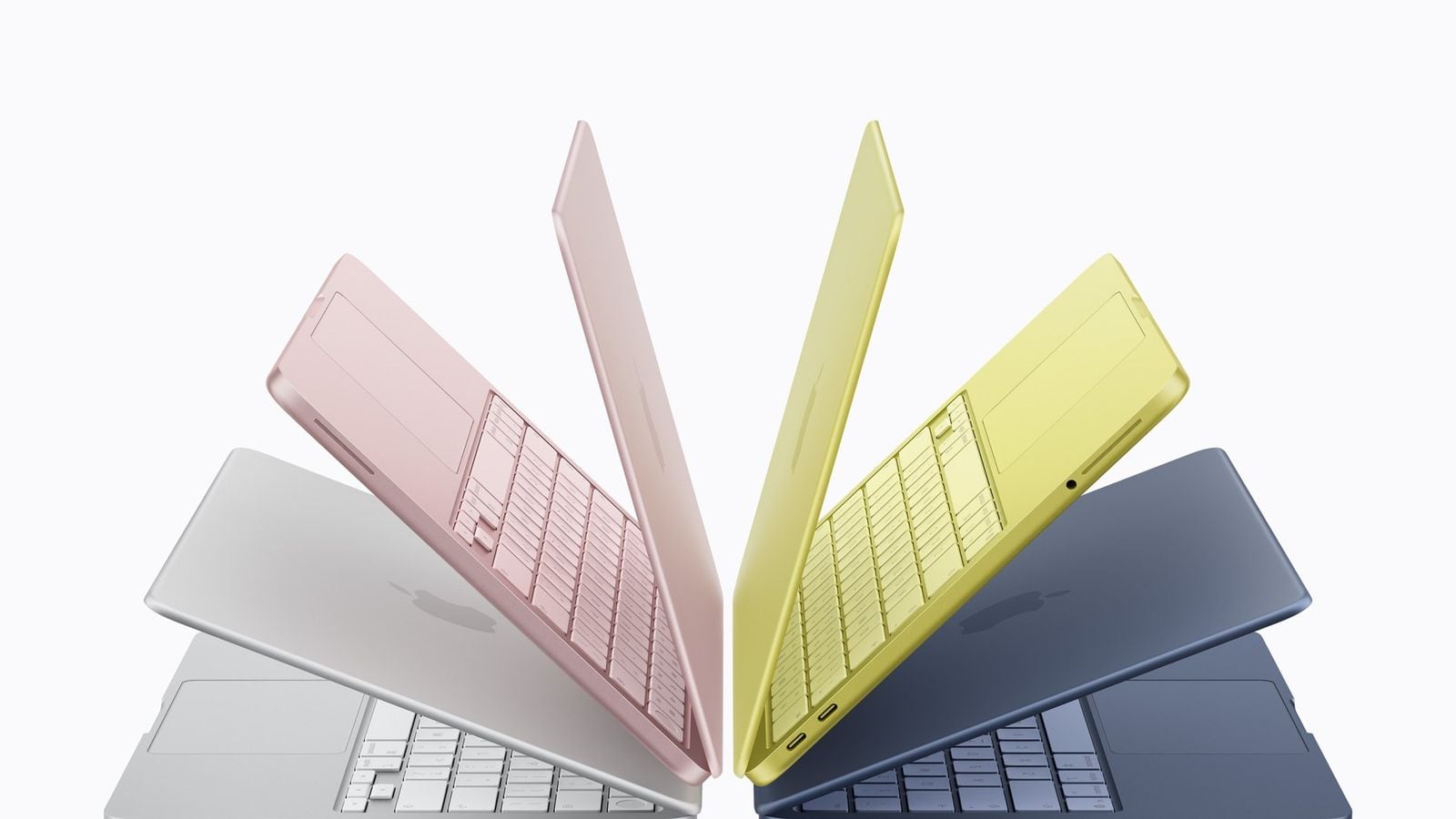 A fanned-out array of MacBook Neo models in its four colors: silver, blush, citrus, and indigo.